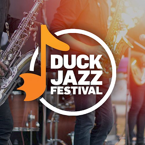 The image shows a logo for the Duck Jazz Festival with musicians playing saxophones and other instruments in the background.