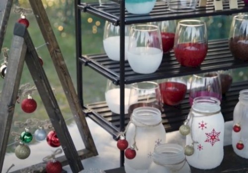 The image shows holiday-themed decorations including jars with painted snowflakes, assorted Christmas ornaments, and colorful candles on shelves.